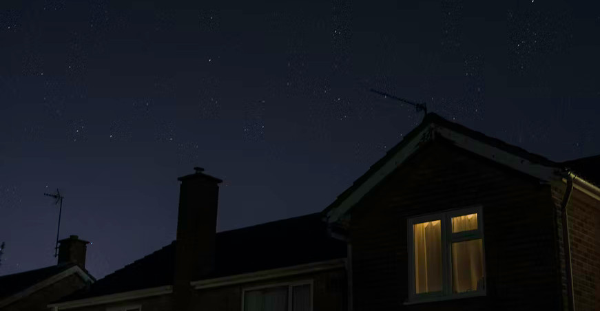 top of a house, night time, stars in the sky