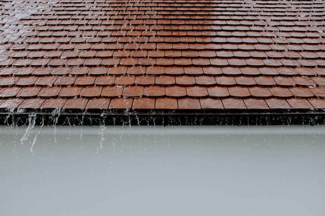 Water running down a roof during rain