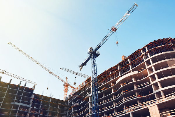 cranes over a building