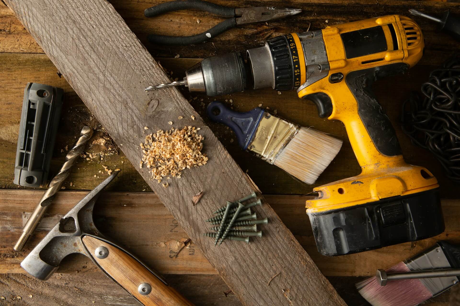 Renovation tools laid out on a table during a strategic property upgrade project. Image via Unsplash