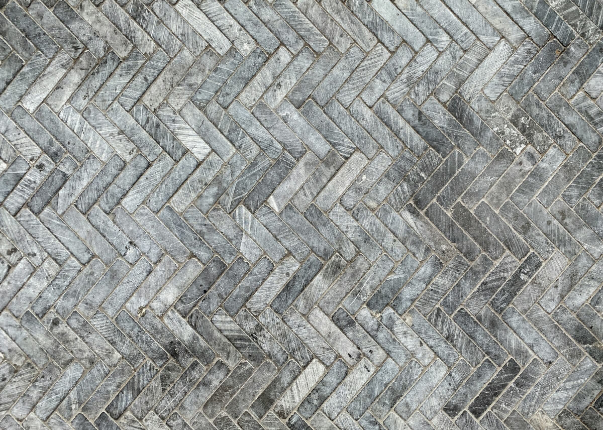 white and brown book on a table near a couch. Image by Pexels