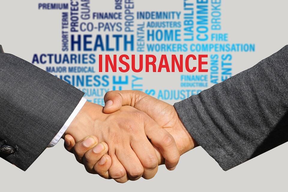 people shaking hands, insurance text