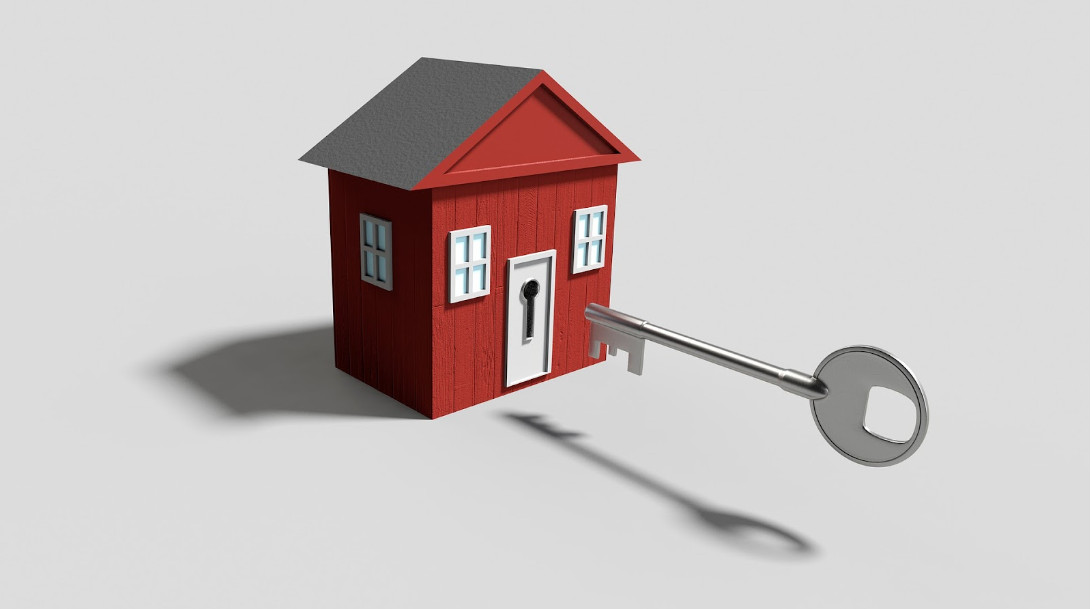 drawing of a red house and a large key