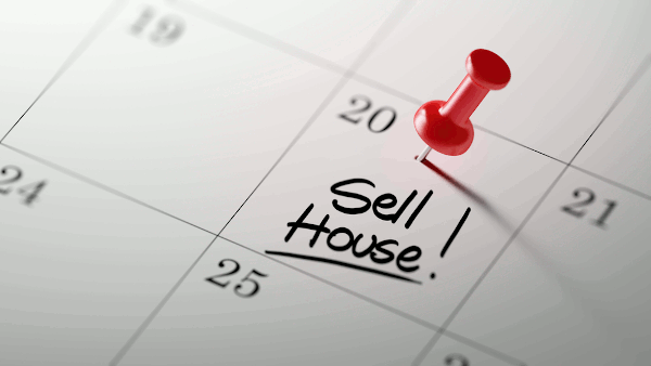 Sell house written on a calendar
