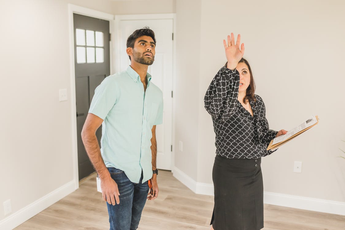 Two people loking up at the ceiling