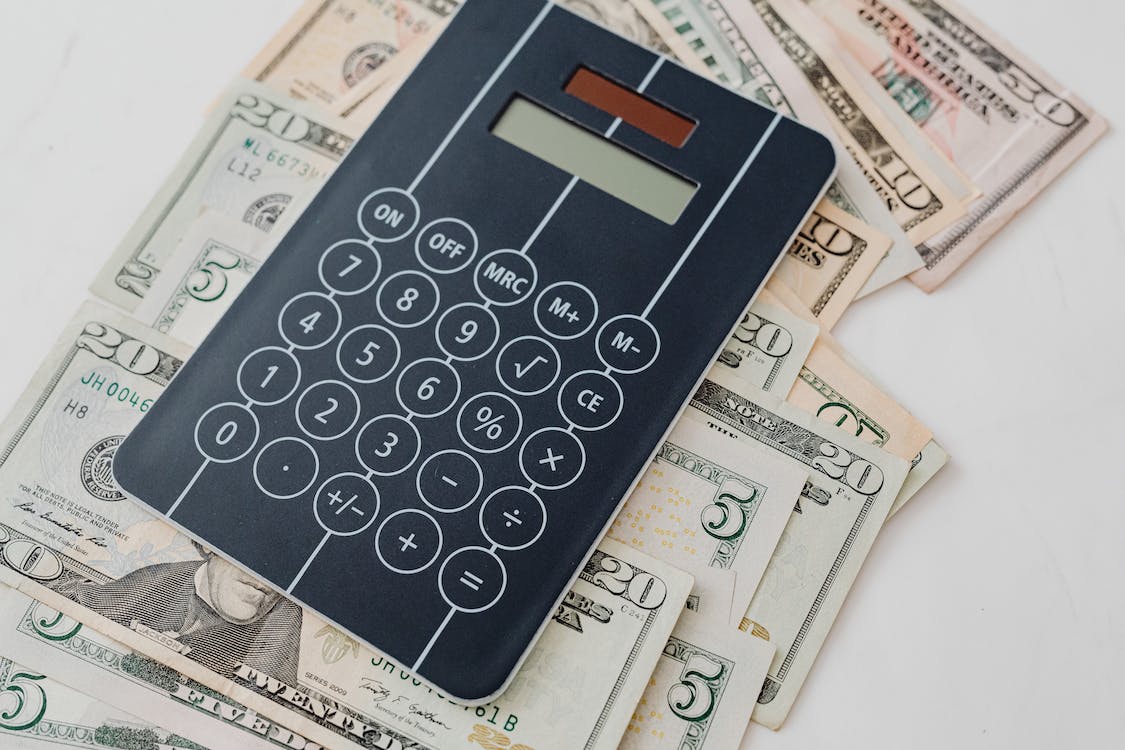 calculator on top of money