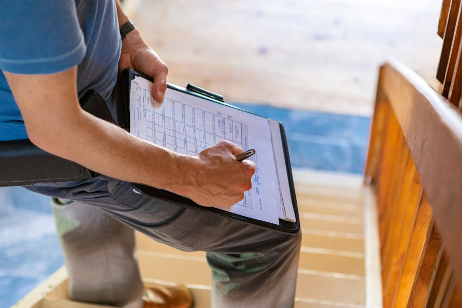 person writing on a paper