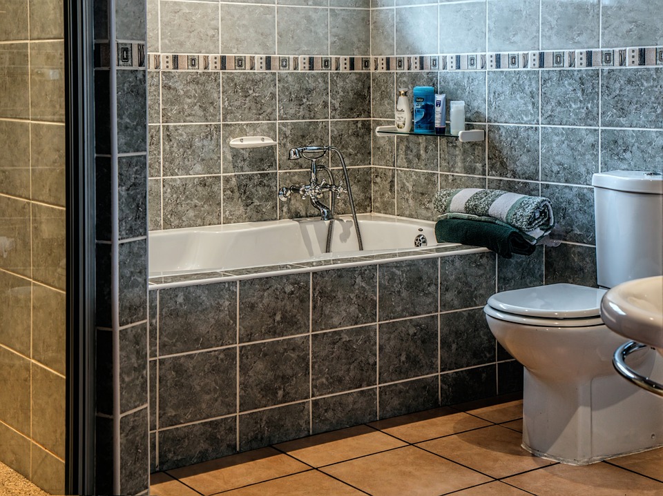 Bathroom, toilet, bath tub, lost of tile