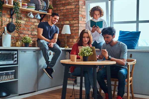 4 persons in a kitchen