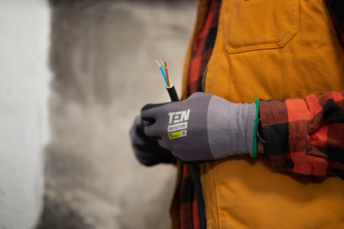 electrician holding wires in his hands