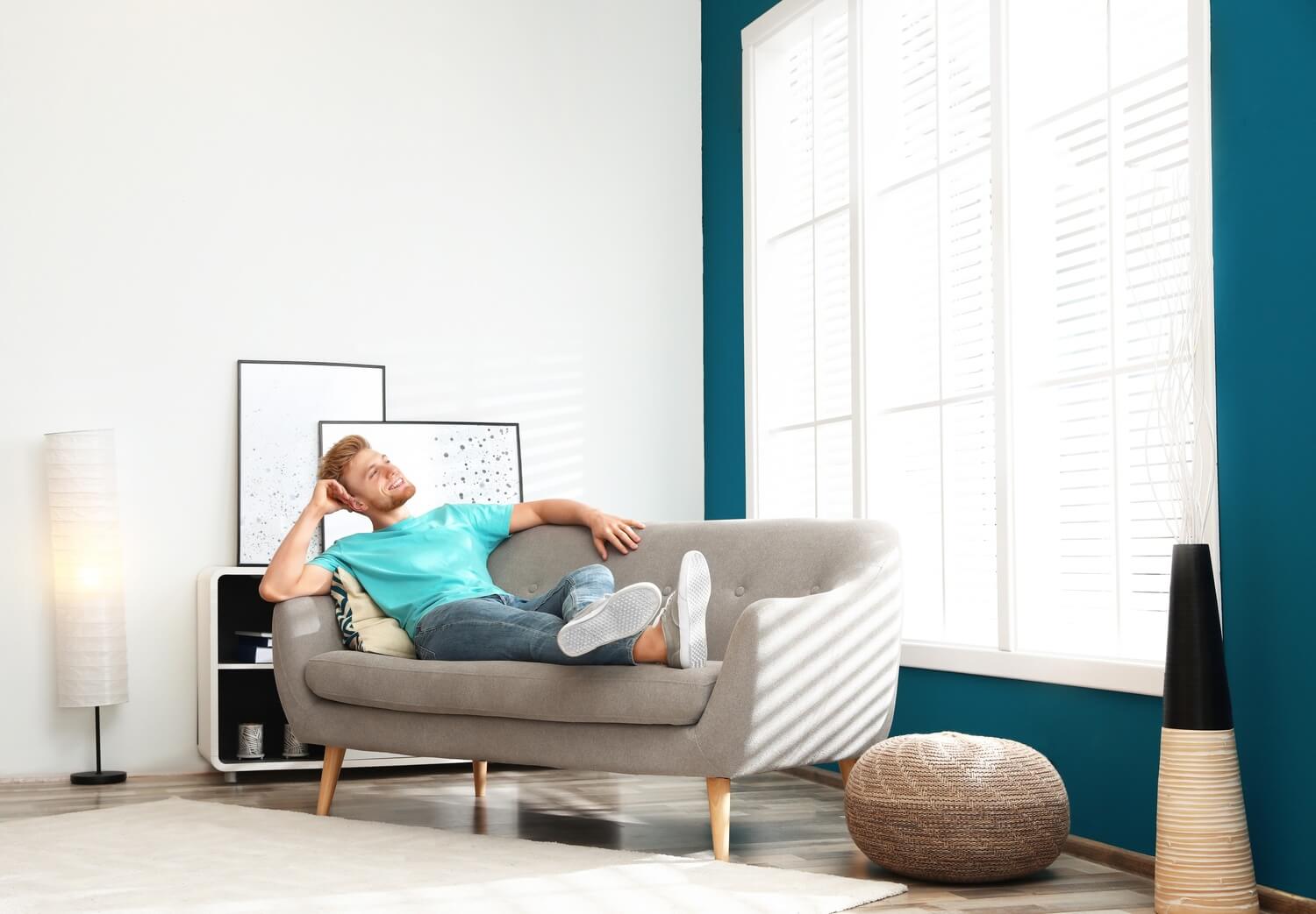 Person laying on a sofa