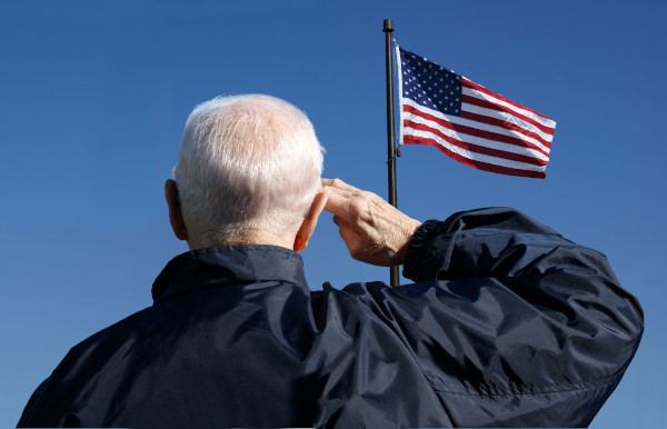 Person Saluting the American Flag