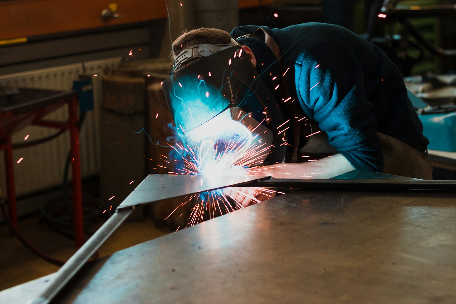 A welder working on a project. Image by Unsplash