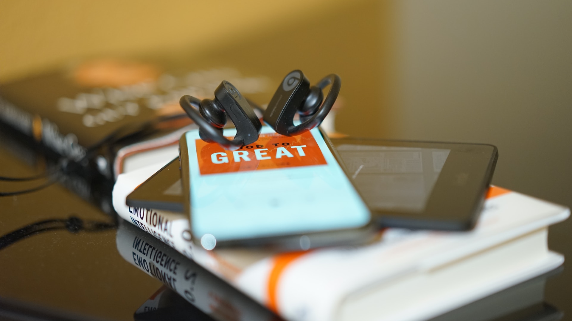 headphones, tablet, phone, books