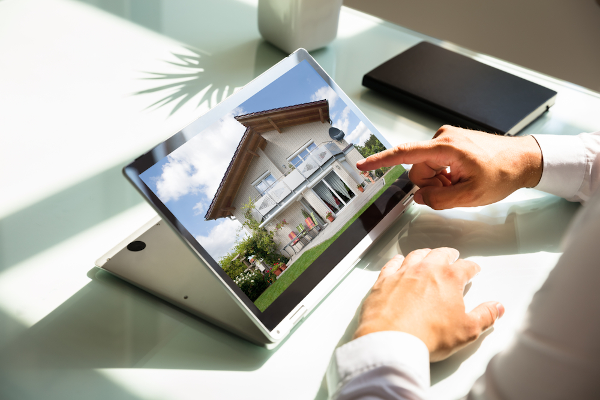 Hands pointing at a computer screen