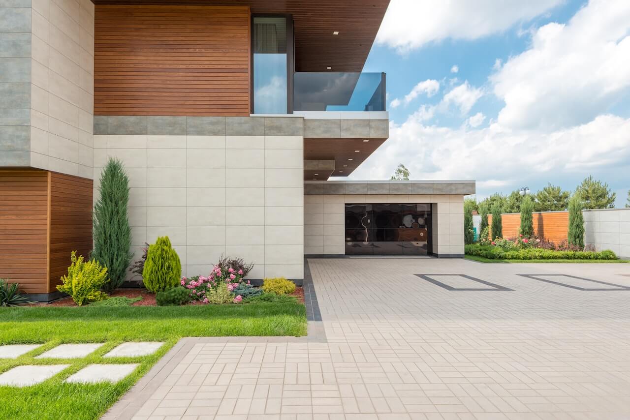 modern house, paved driveway, garage