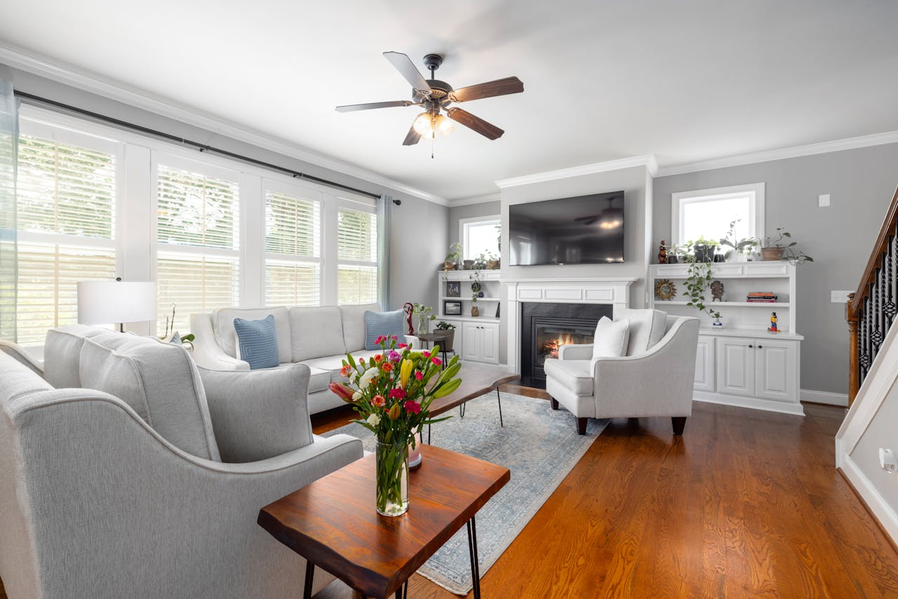 Livingroom with gray walls, gray and white sofas. Image by Pexels
