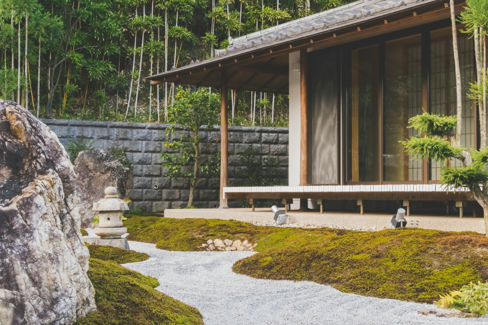 wooden house with sliding glass doors - Image by by Unsplash