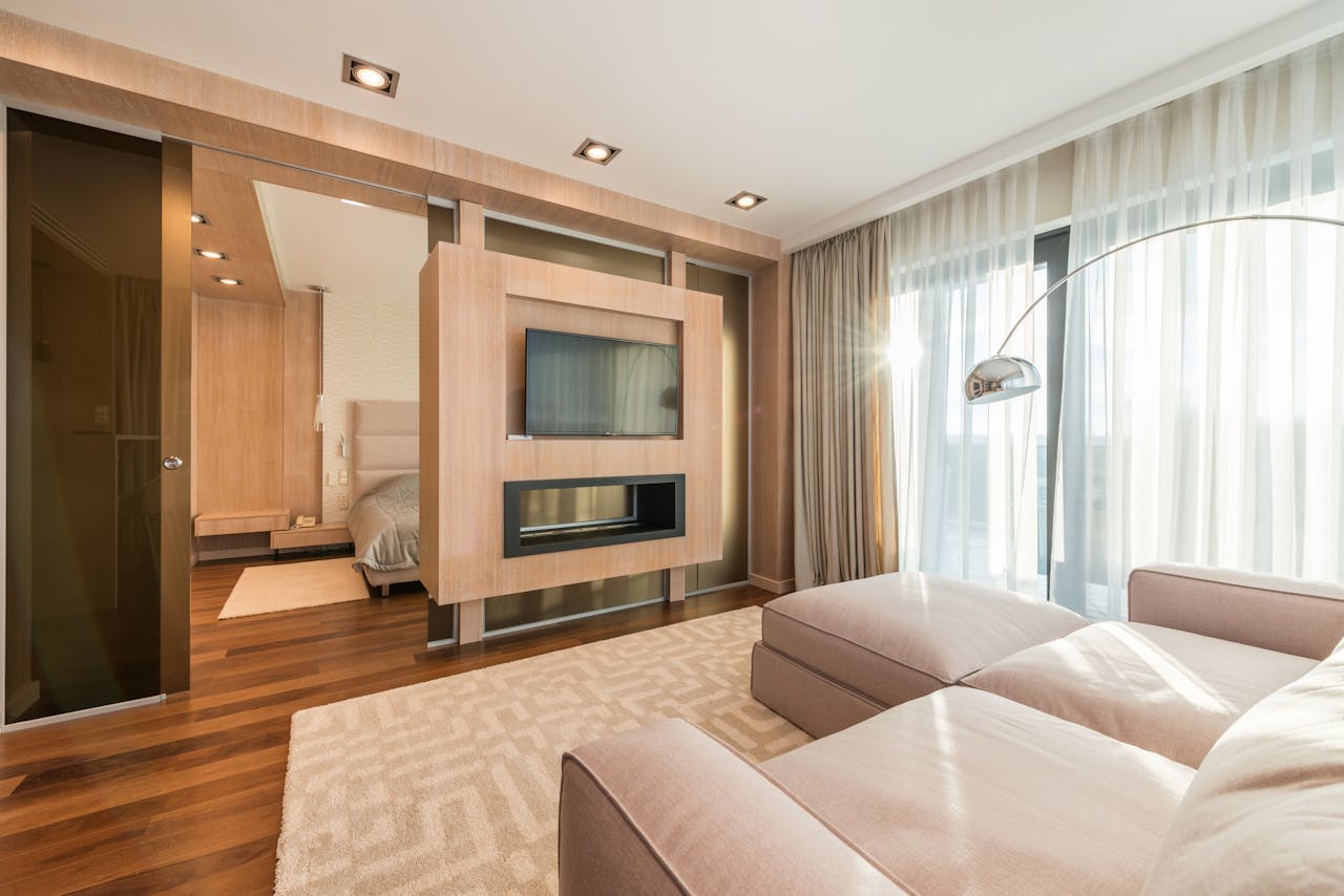A living room with a beige sofa. Image by Pexels