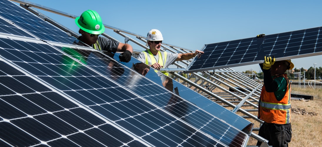 People installing solar panels