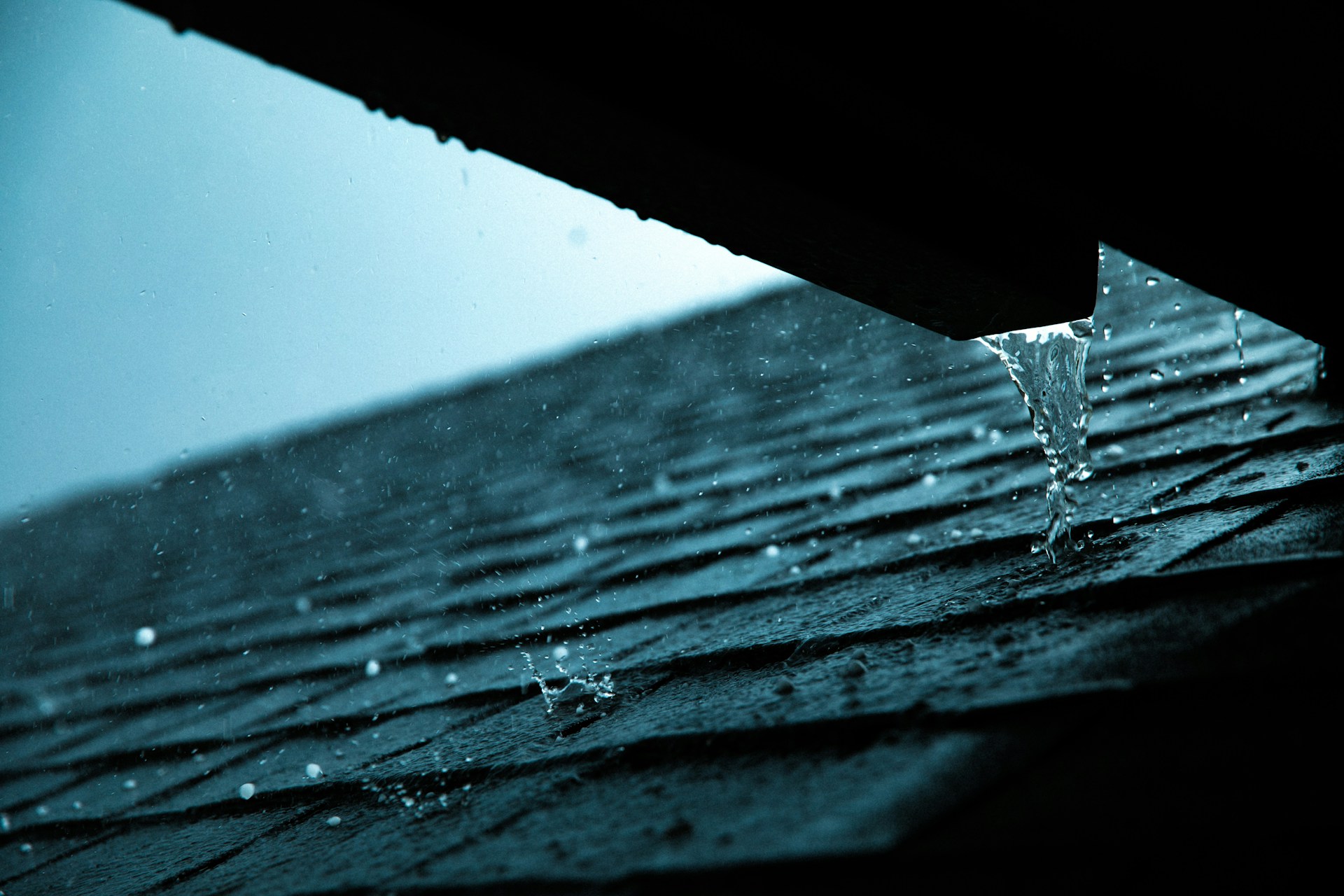 Close-up of a rain gutter on a roof showing potential water damage warning signs. Image by Unsplash