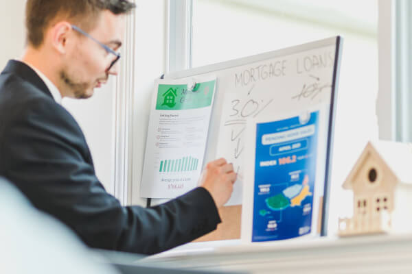 person writing on a white board