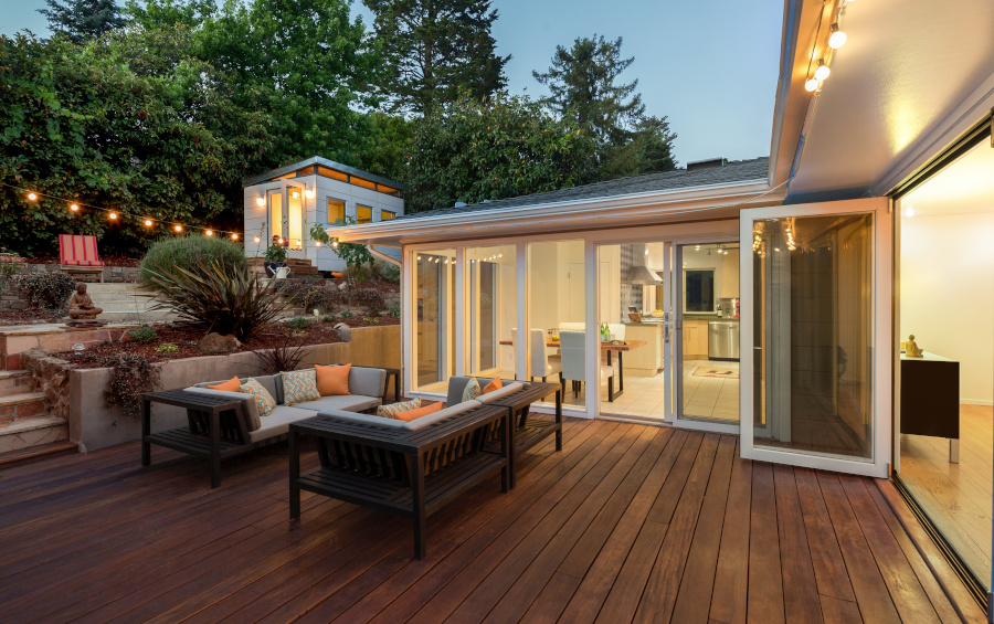 modern house, lots of windows, wood deck