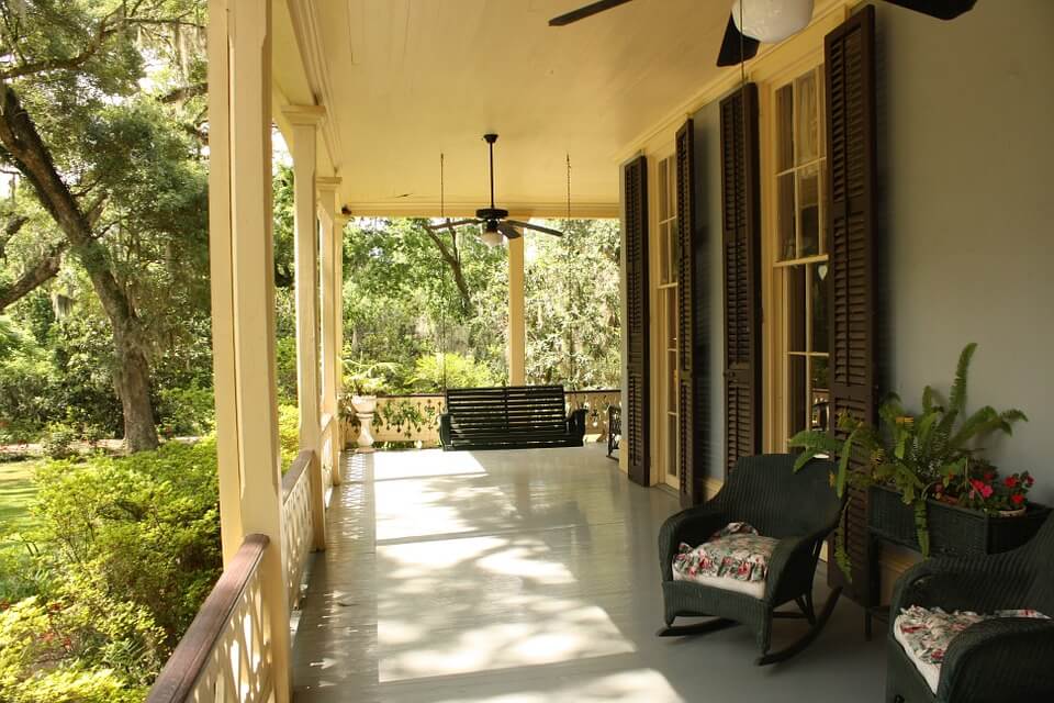 Porch with swing chair, rockingchair, plants, ceiling fan/light