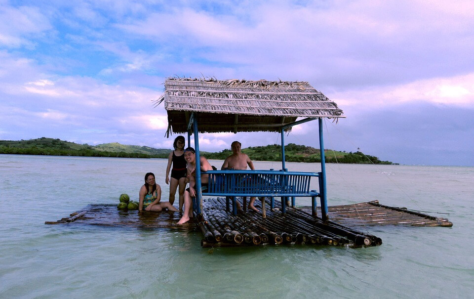 people on a raft in the ocean