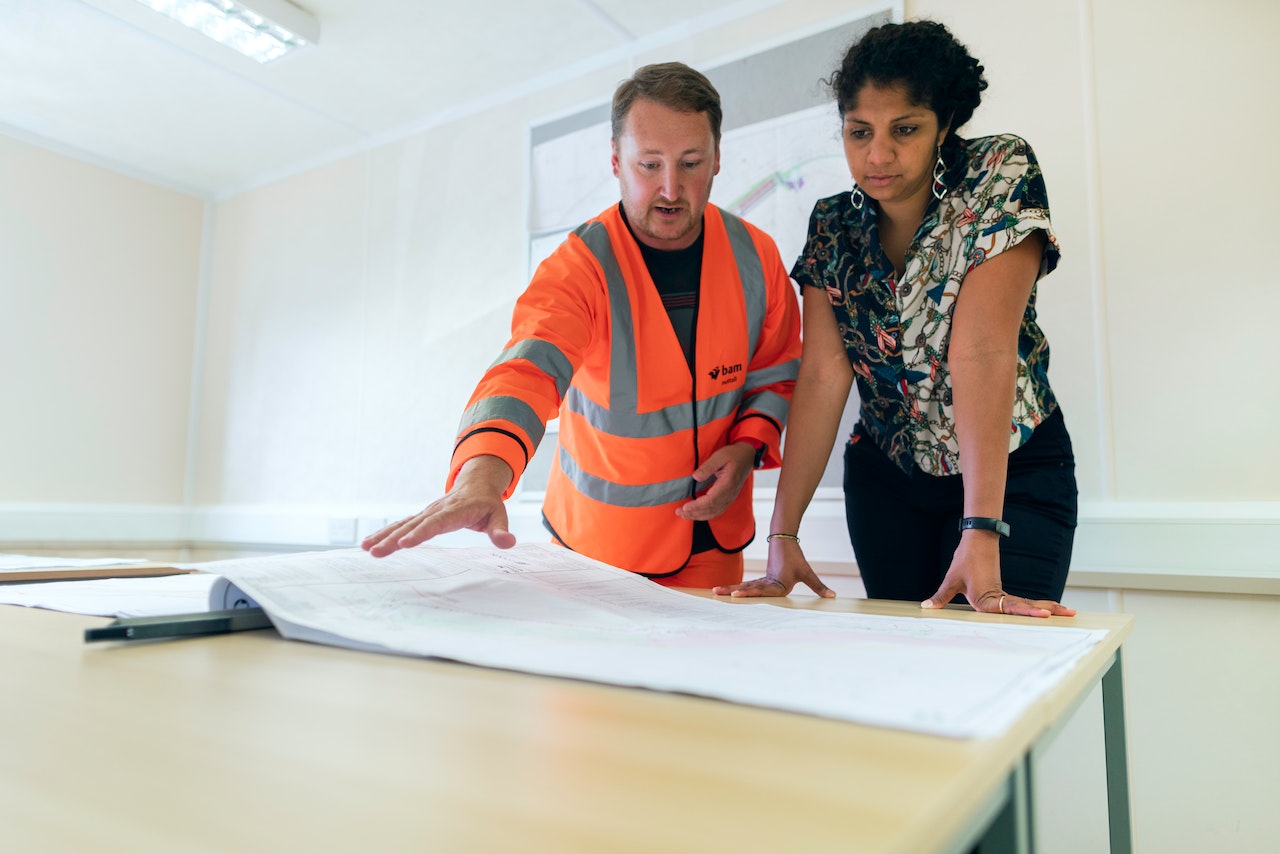 people looking at a floorplan