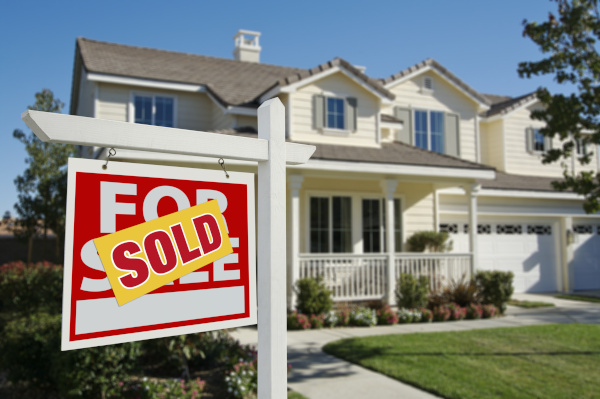 Sold sign in front of a house