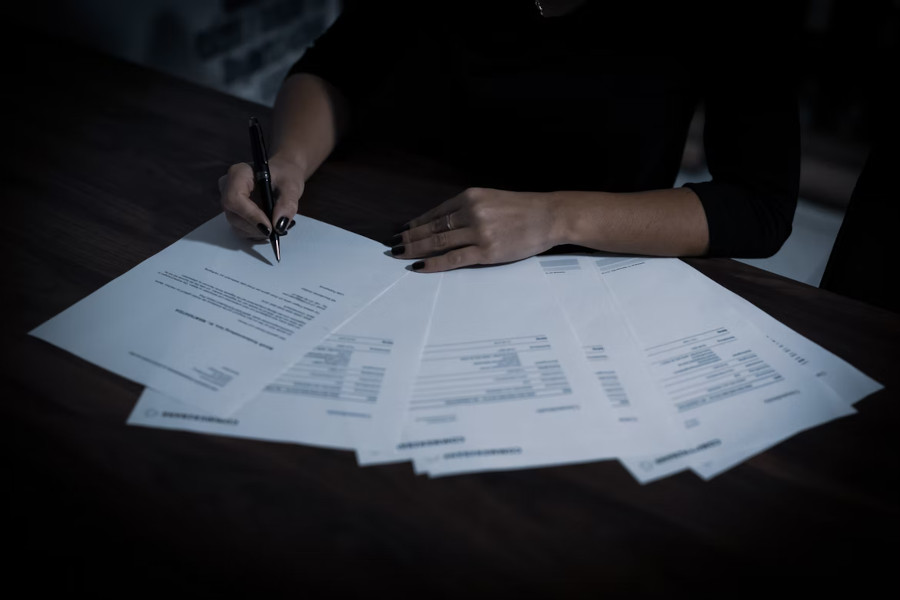 person filling out paperwork