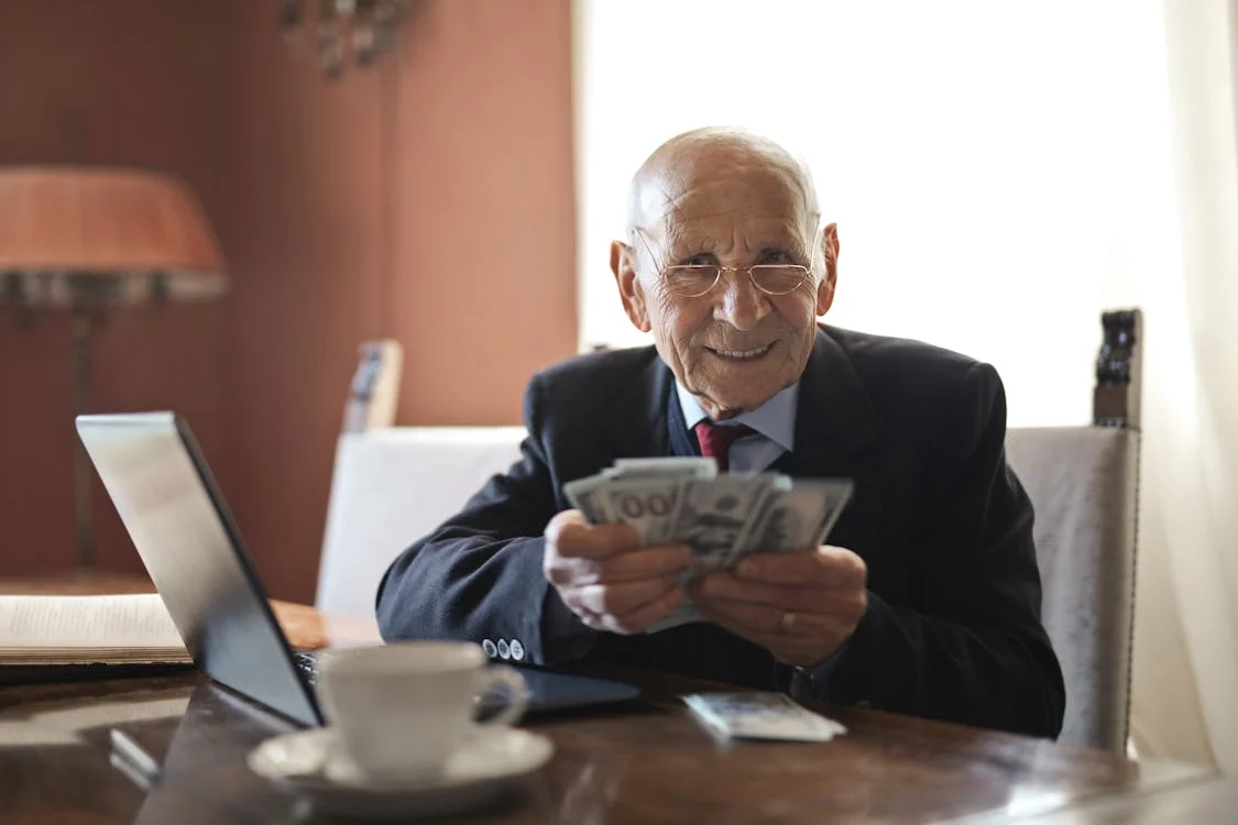 Person holding a lot of money