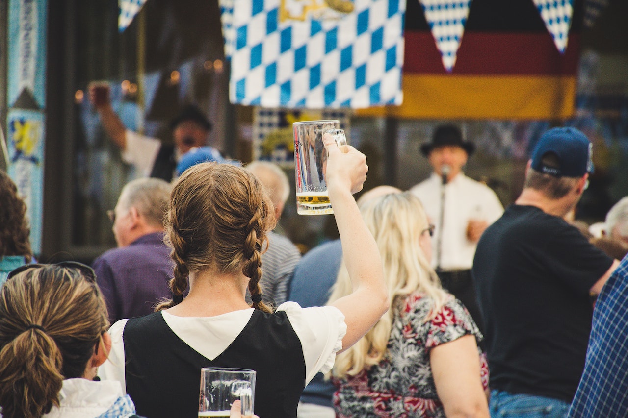 Oktoberfest, person holding up a beer mug