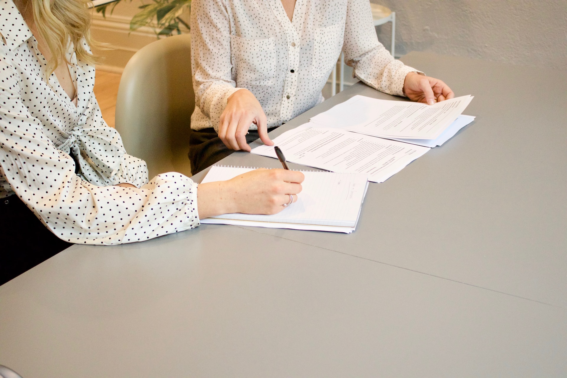 2 people looking at paperwork