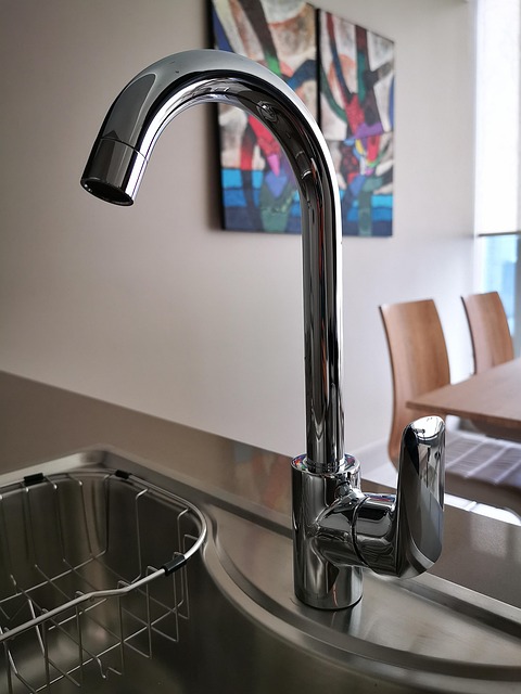 Stainless steel pipe on a ceramic wall. Image by Pexels