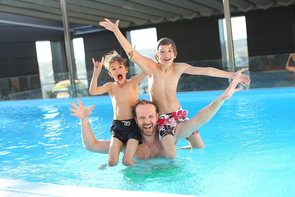 3 people in a Swimming pool