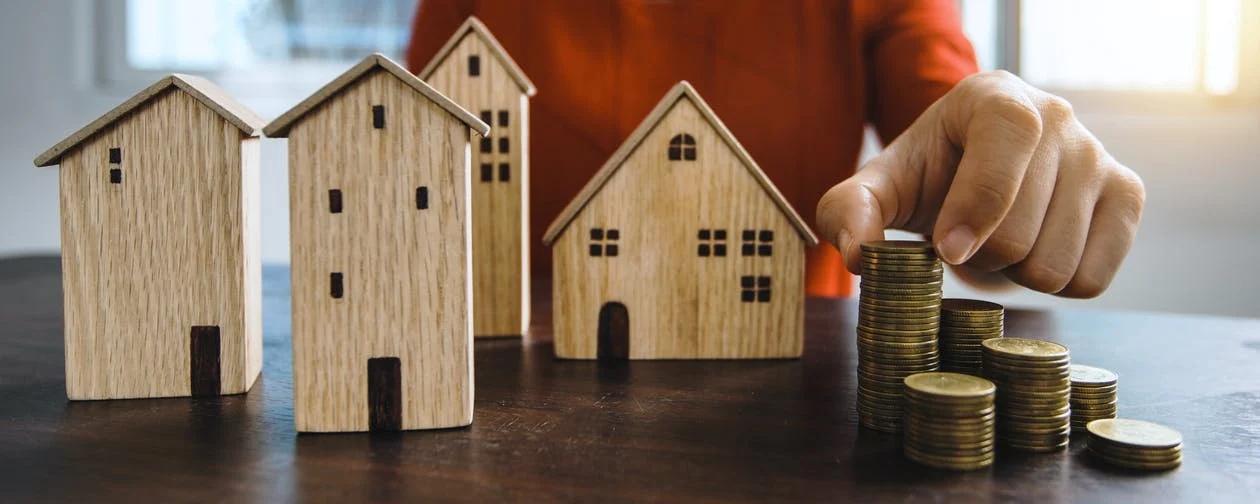 4 wood house, coins on table