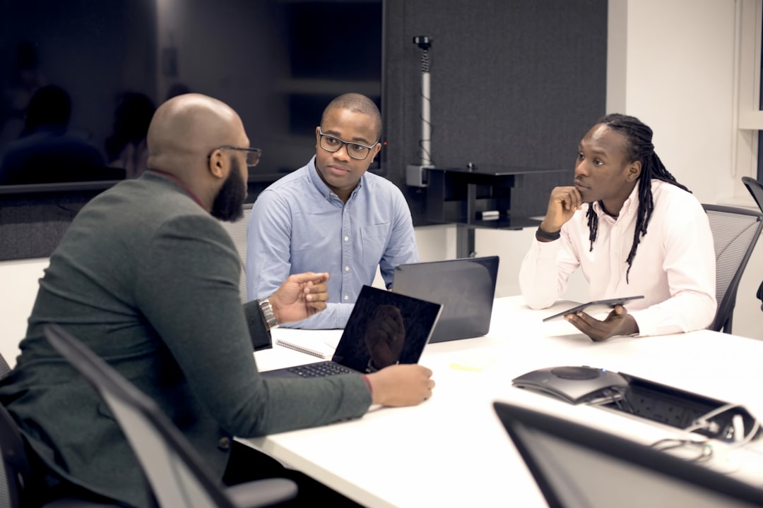 Business professionals enhancing collaboration between sales and marketing teams using account mapping strategies