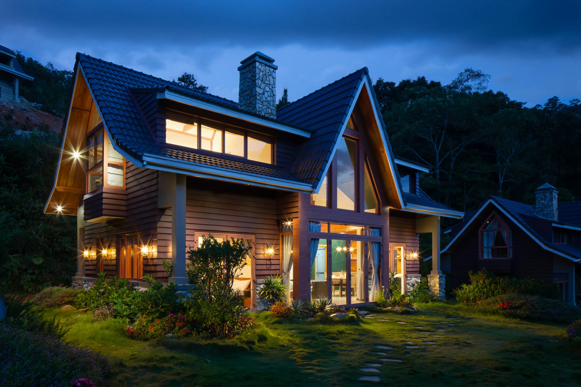 House lit up at night. Image by Unsplash