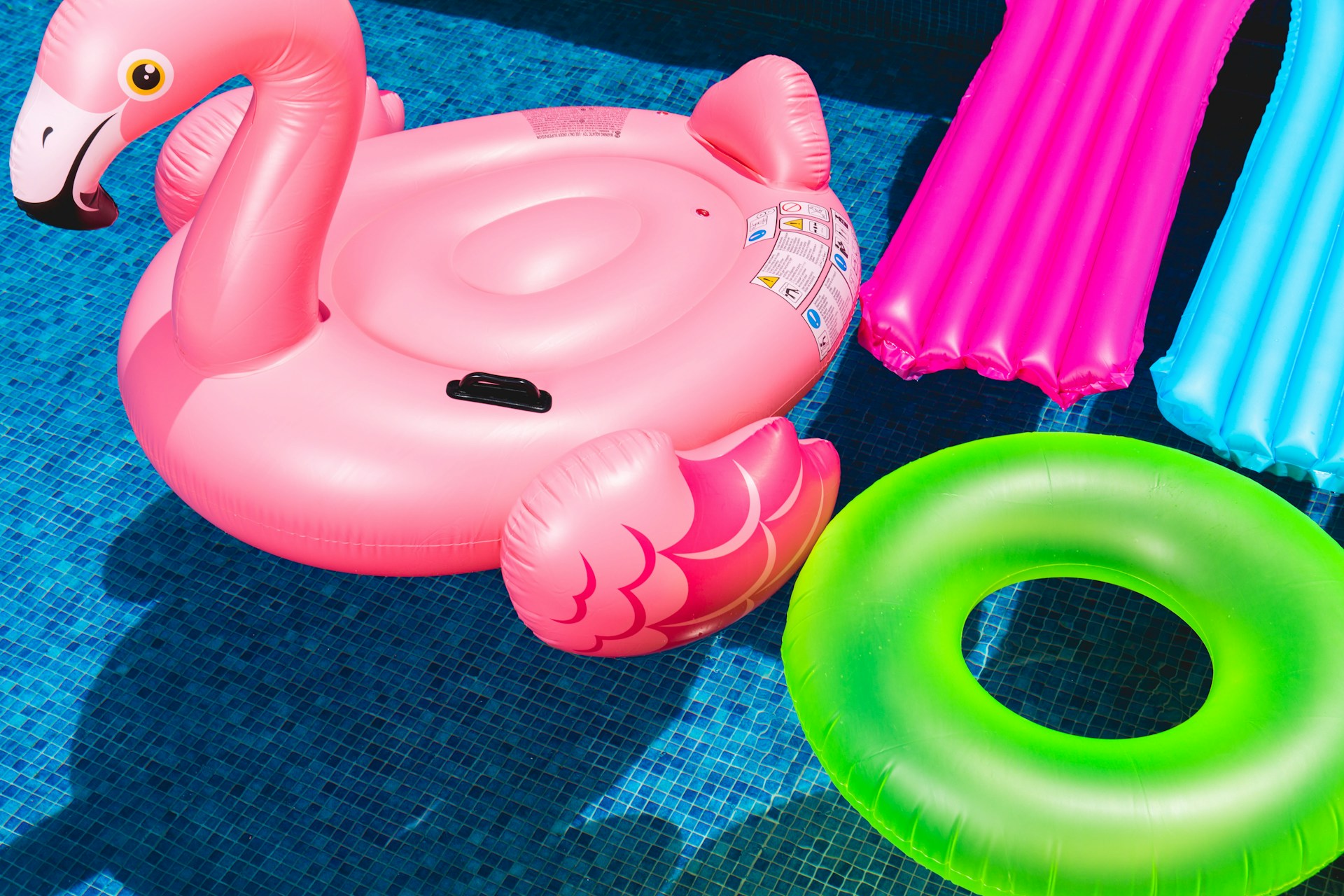Pool with inflatables. Image by Unsplash