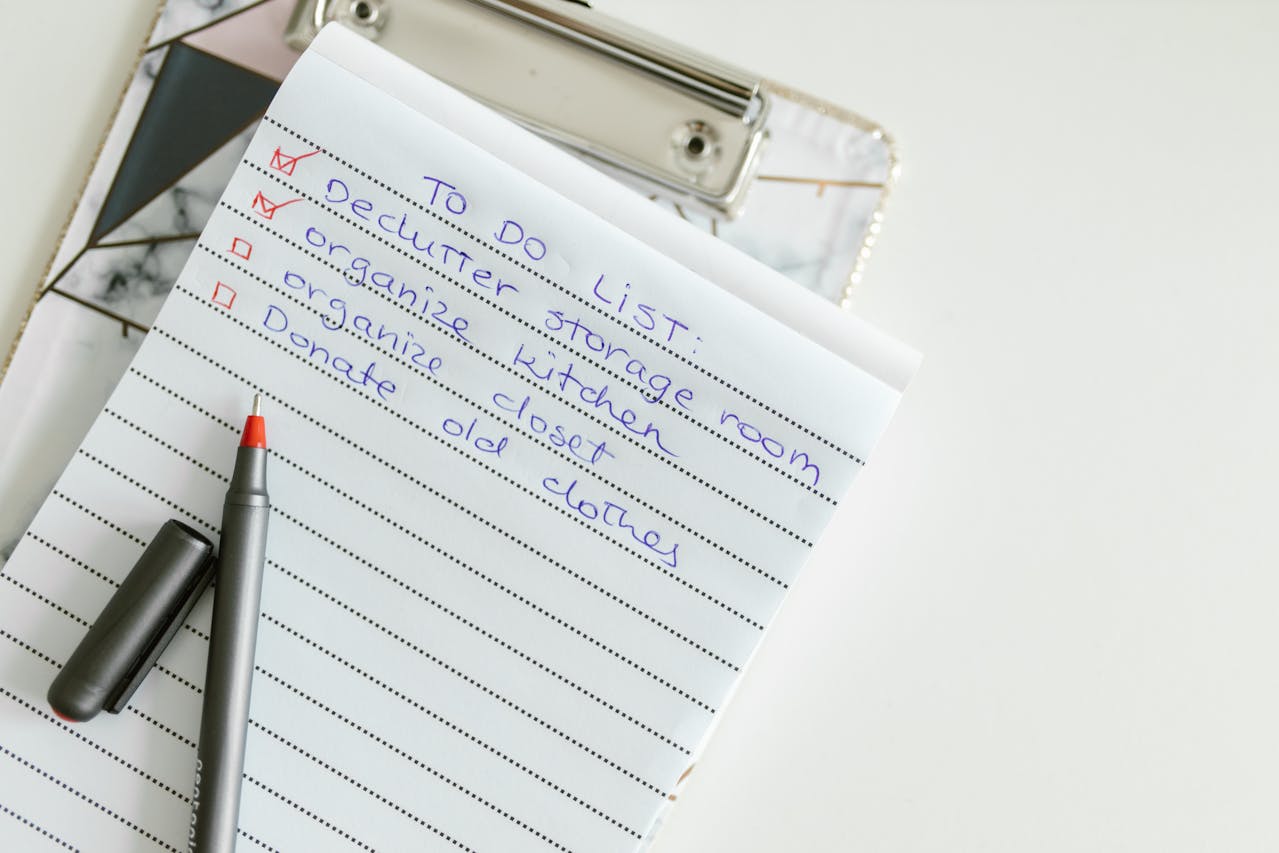 person writing on a paper