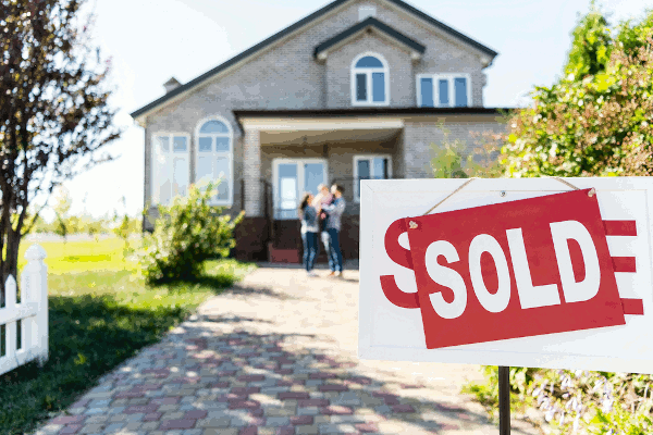 For Sale Sign in front of a house