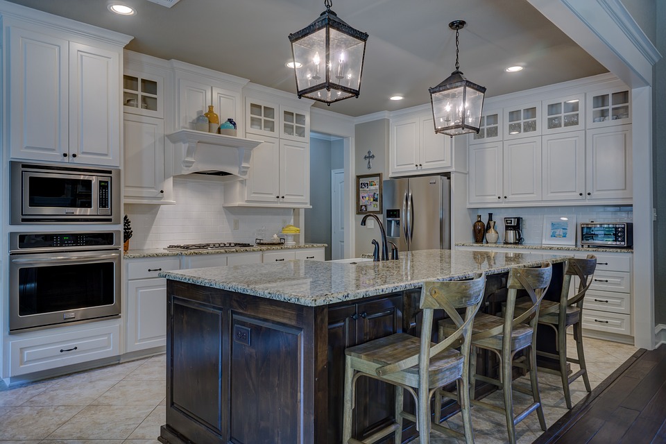 modern kitchen, white cabinets, brown island