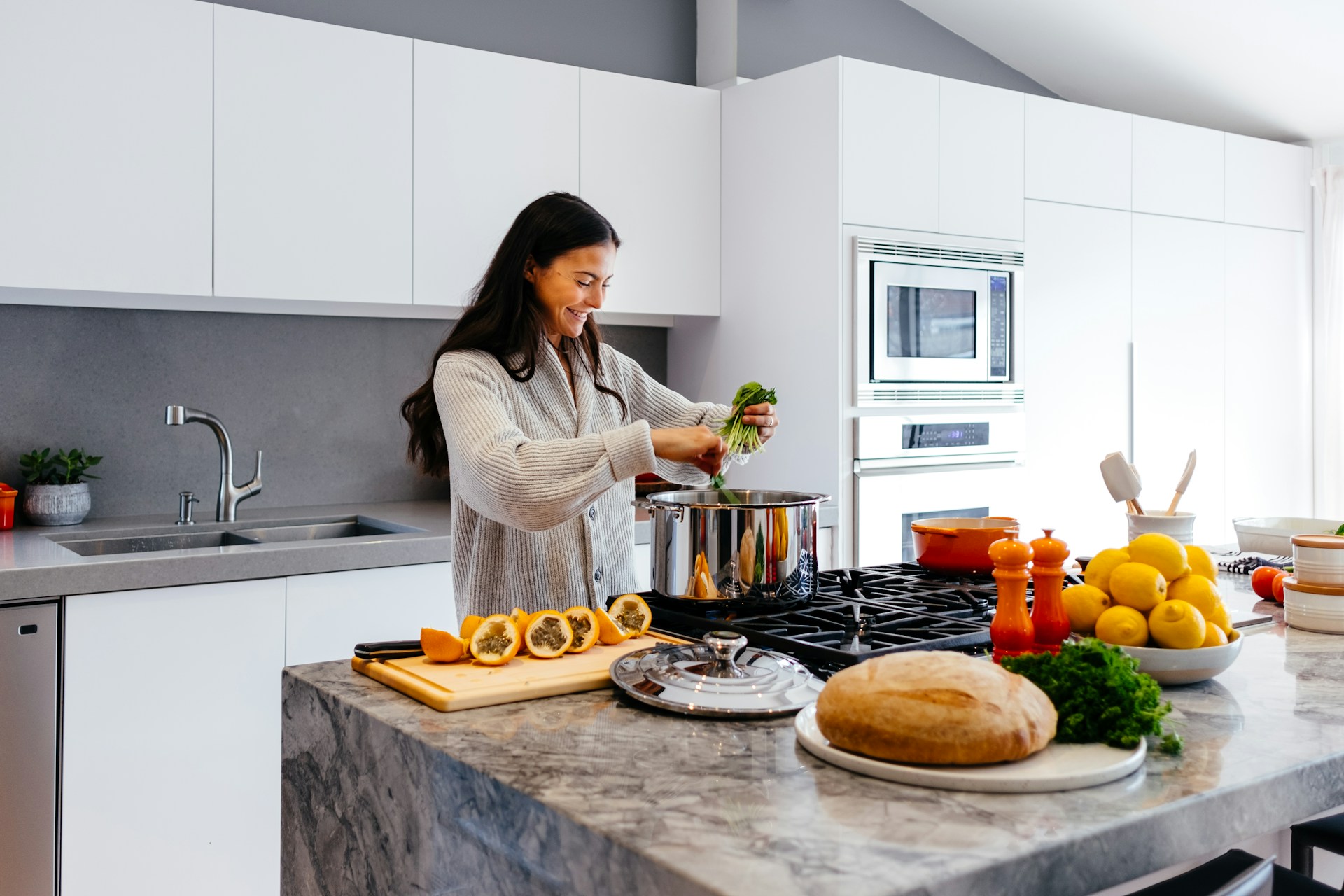 Person cooking in a kitchen. Image by Unsplash