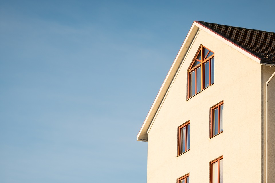 Part of a white house, blue sky