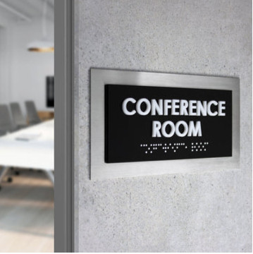 ADA compliant sign outside a conference room