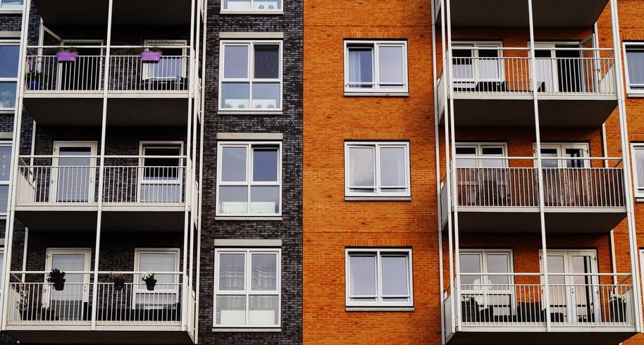 Two Colored Brick Apartment building. Image by Pexels