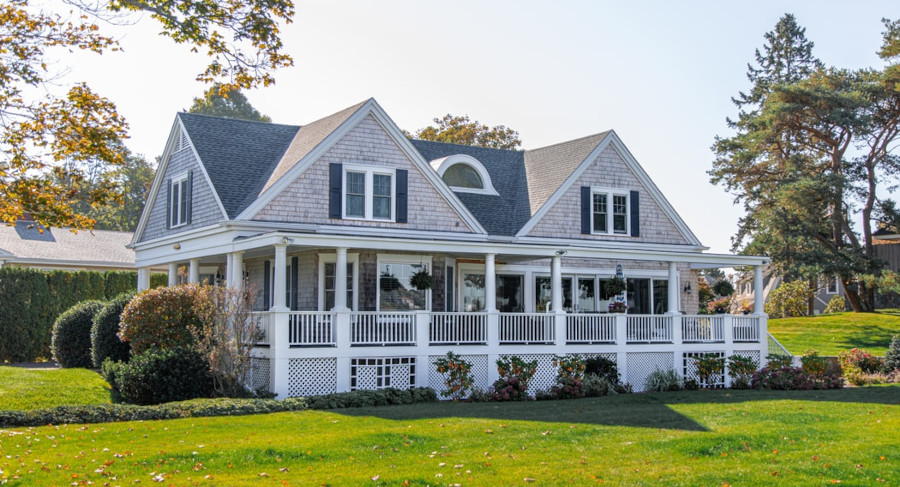 Gray house with a big wrap around porch