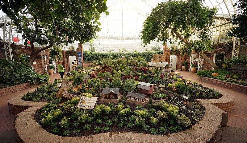 Conservatory, lots of plants, miniature houses